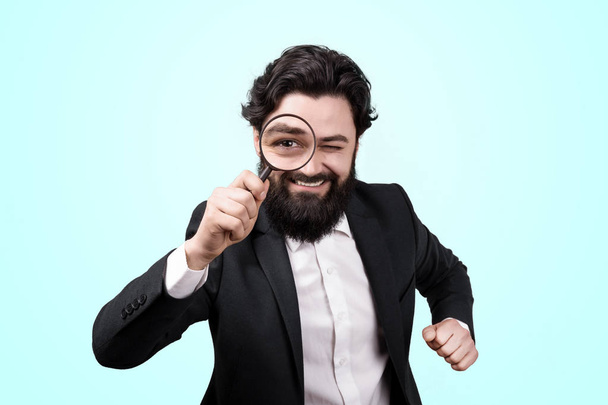 cheerful businessman with magnifier glass - Photo, Image