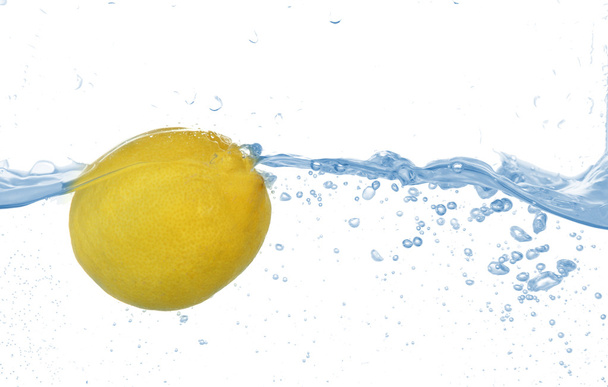 Juicy lemon under water, isolated on white - Photo, Image