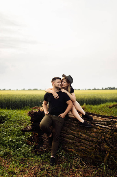 Beautiful young couple hugging outdoors - Photo, image