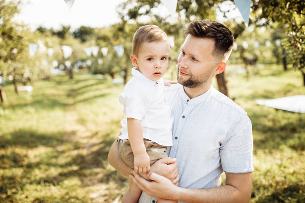 Happy young father  with son in the park - Фото, изображение