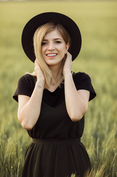 Beautiful young  woman  in wheat field  - Photo, Image