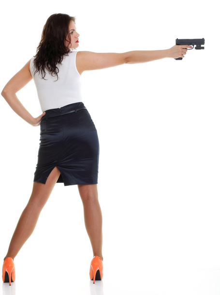 Young brunette woman with gun isolated on white - Fotó, kép
