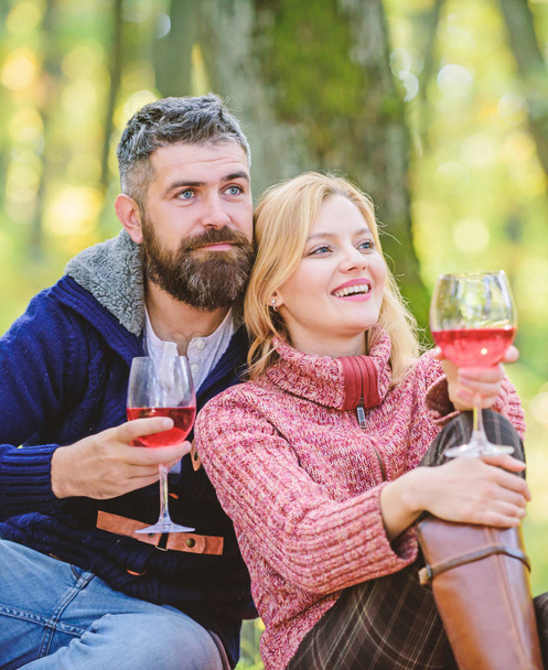 This should be fine. happy woman and bearded man drink wine. Family picnic. Valentines day. camping and hiking. cheers. couple in love relax in autumn forest. love date and romance. Spring mood - 写真・画像