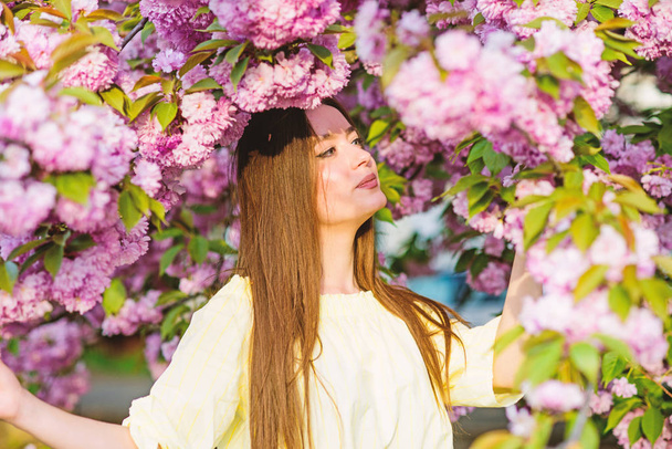 skincare and spa. Natural cosmetics for skin. woman in spring flower bloom. girl in cherry flower. Sakura tree blooming. blossom smell, allergy. natural summer beauty. Wonderful smell - Photo, image
