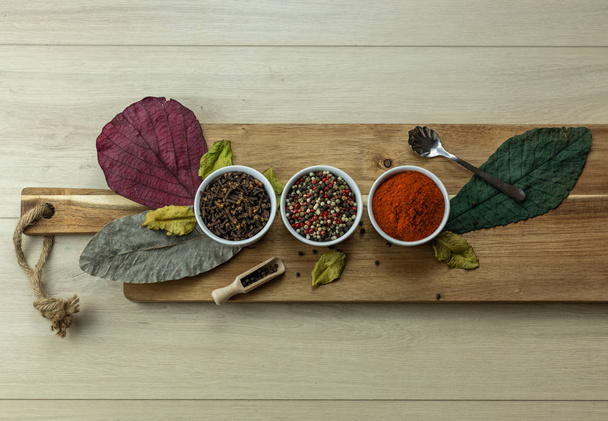 Autumn spices, paprika, colored pepper, cloves - Foto, imagen