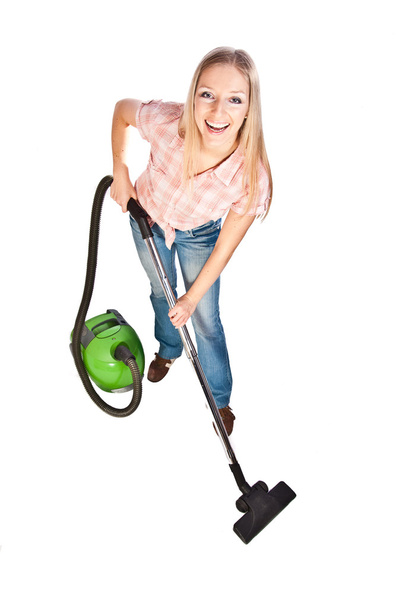 Woman cleaning with vacuum cleaner - 写真・画像