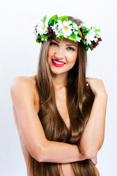 Fashion model with hairstyle and flowers in her hair - Φωτογραφία, εικόνα