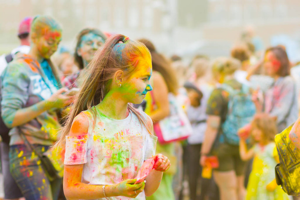 Dnipro, Ukraine - June 29, 2019: Festival of colors. People covered with colored powder. Color holi festival. Celebrants dancing during the color Holi Festival - Foto, Bild