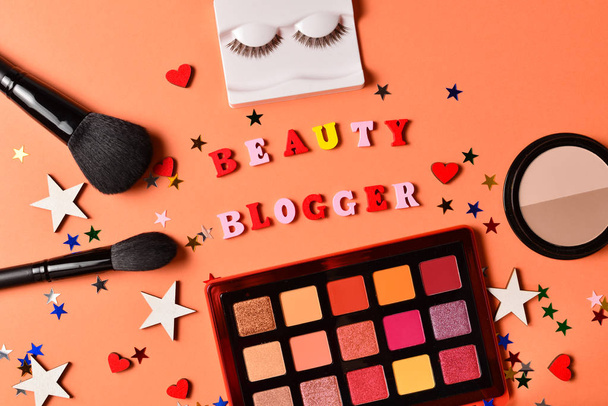 Beauty blogger text on an orange background. Professional trendy - Foto, Imagen