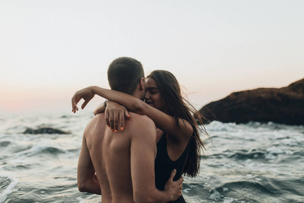 lovely couple kissing in the sea - Photo, image