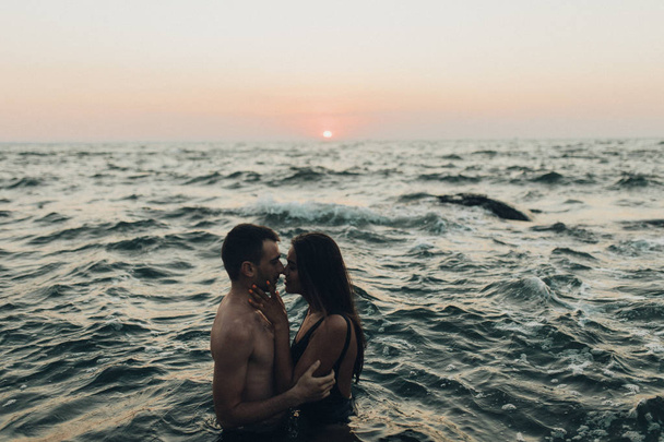 lovely couple kissing in the sea - Photo, image