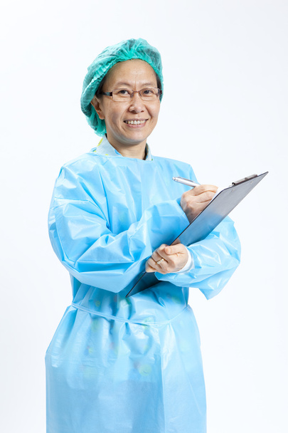 Smiling mature female medical doctor with stethoscope and clipboard - Foto, immagini