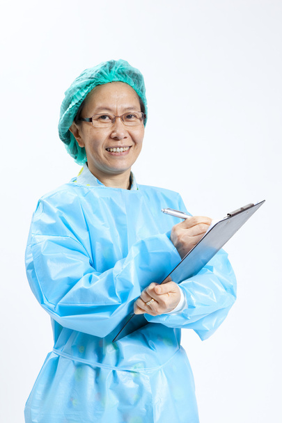 Smiling mature female medical doctor with stethoscope and clipboard - Fotografie, Obrázek