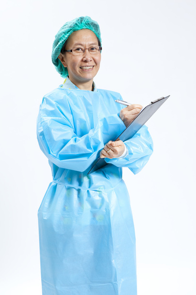 Smiling mature female medical doctor with stethoscope and clipboard - Fotoğraf, Görsel