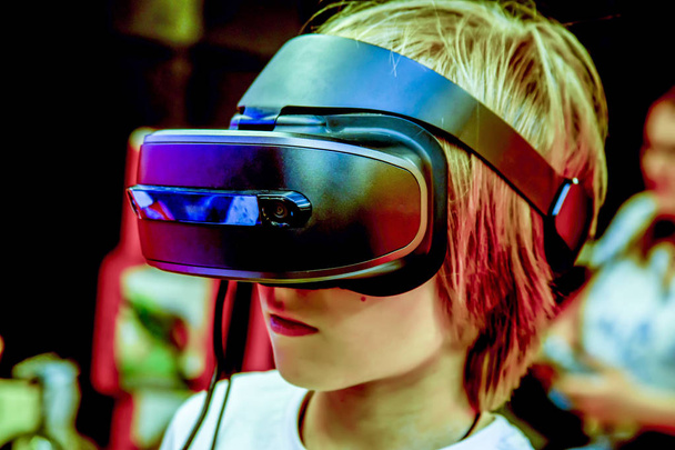 Young boy in virtual reality goggles headset. - Fotografie, Obrázek