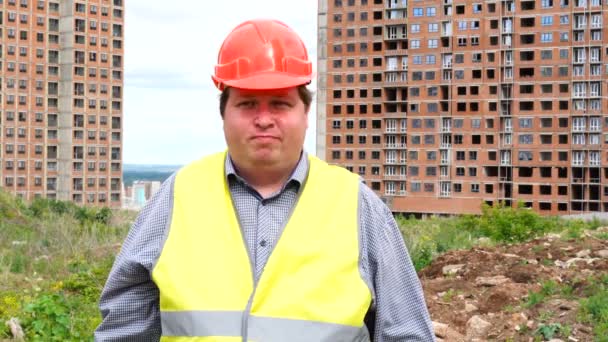 Male builder foreman, worker or architect on construction building site is dancing - Materiał filmowy, wideo