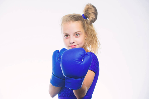 Sport upbringing. Upbringing for leadership and winner. Strong child boxing. Sport and health concept. Boxing sport for female. Be strong. Girl child with blue gloves posing on white background - Photo, image
