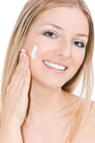 Woman creaming face - Foto, Bild