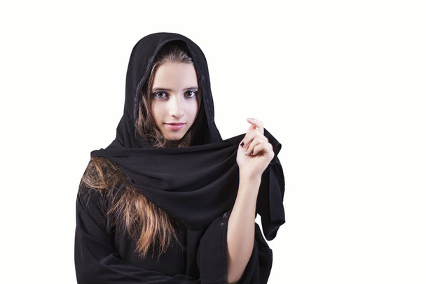 Arab ,muslim,girl closeup on a white background.Arab saudi emirates woman face looking at side isolated on a white background. - Фото, зображення