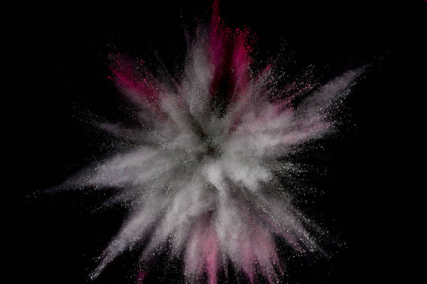 Colored powder explosion. Abstract closeup dust on backdrop. Col - Photo, Image