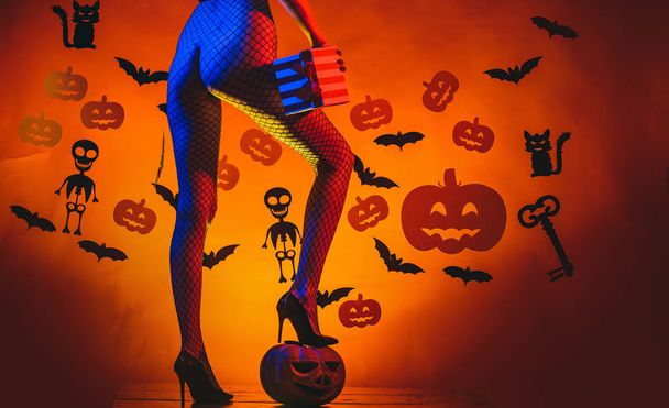 Autumn time for Fashion sale. Sexy Horror background. Womens clothing store celebrates Halloween. Pumpkin with sexy ass. Happy Halloween Sexy Witchs with Big sexy ass. - Foto, Imagen