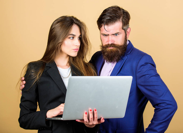 Discussing progress. Woman and guy colleague working together. Business plan. Business lady and director or boss surfing internet. Business meeting. Man bearded manager show financial report laptop - Foto, Bild