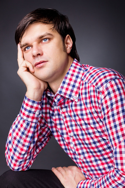 Closeup portrait of a young man thinking about a problem - Φωτογραφία, εικόνα