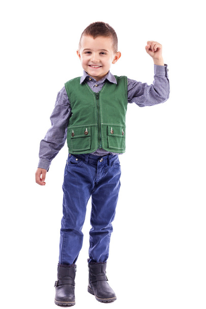 Portrait of a happy boy with arm up - Фото, изображение
