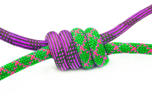 Colored ropes tied in climbing knot  - Фото, изображение