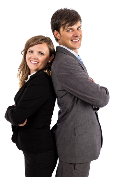 Business couple standing back to back smiling at the camera - Foto, imagen