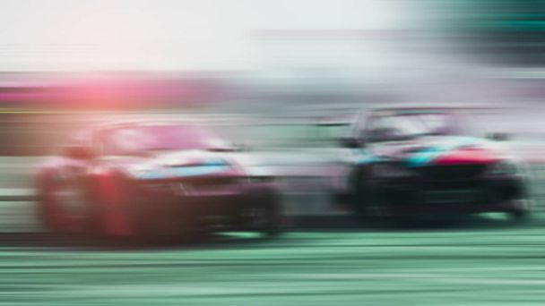 Blurred -two sports cars are competing battle on and running at  - Photo, Image