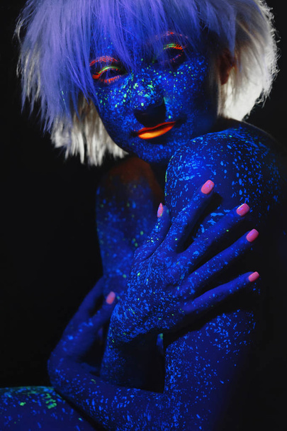 Body art Luminofor Glow make up in neon light - Photo, Image