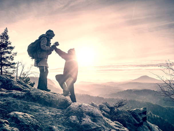 Tourists couple stay on summit and takes memory picture  - Photo, Image