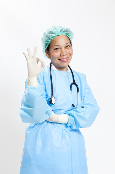 Happy smiling female doctor with okay gesture, isolated on white background - Photo, image