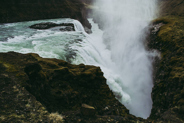 The edge of the Gullfoss waterfall and splashes flying over it - Фото, изображение