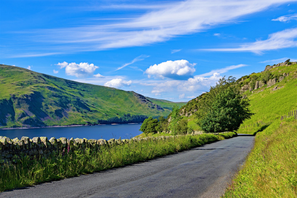Capturing the beautiful and picturesque nature and open spaces, at Haweswater Reservoir, in the Lake District.  Providing an awesome blend of risen roadside, sweeping valley, mountainous terrain, a gargantuan reservoir, lush greenery and rock forms. - Photo, Image