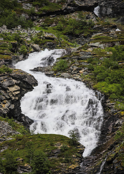 picturesque view of mountain waterfall with cold rapid flow , Strynefjellet, Norway  - Фото, зображення