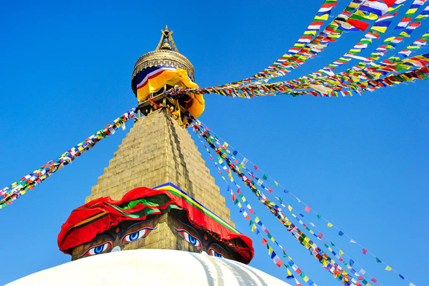 Prayer flags flying on the Boudhanath Stupa. symbol of Kathmandu, Nepal. - Φωτογραφία, εικόνα