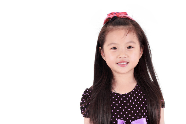 asiatische kleine Mädchen auf einem weißen Hintergrund - Foto, Bild
