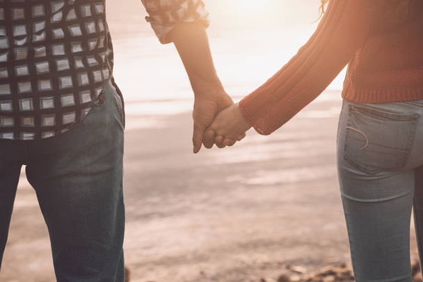 Romantic loving couple holding hands - Fotó, kép