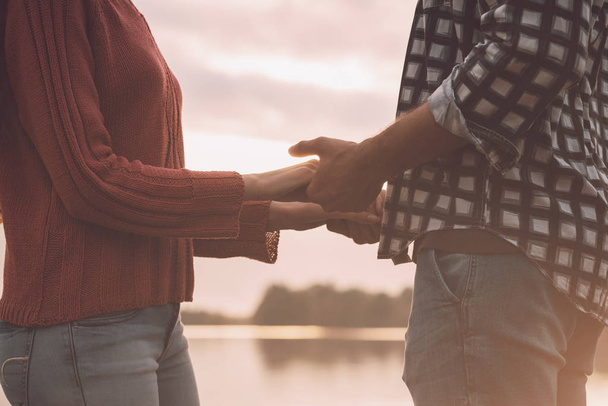Romantic loving couple holding hands - Zdjęcie, obraz