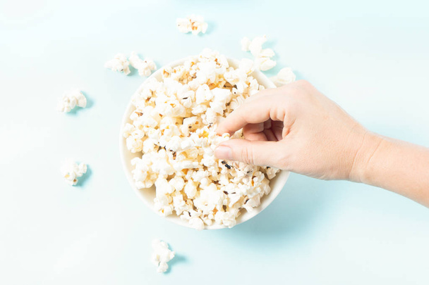 Scattered popcorn over yellow background - 写真・画像