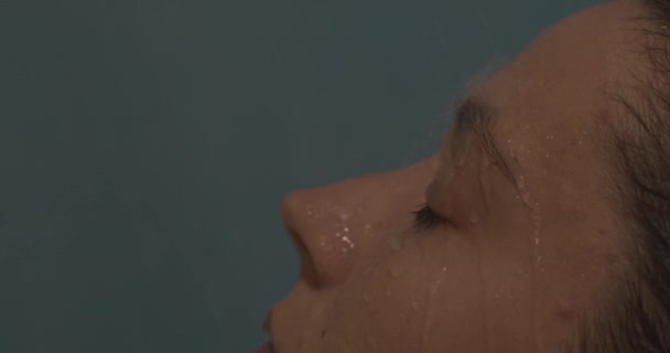Girl face macro close up portrait in bath shower rain. Deep cleansing skin doing beauty spa treatments gets pleasure enjoy moment feel calm free pacified balanced - Video