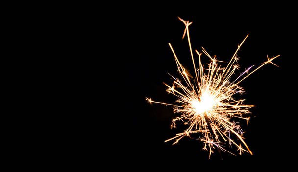 Christmas sparkler on black background. Bengal fire - Φωτογραφία, εικόνα