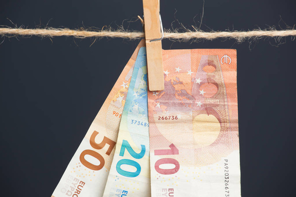 Euro banknotes, money of the European economic community. The money is the fruit of work, of the benefits of the investment, the losses or profits of the company, the profits of the bank. Money is necessary for life in today's society. - Photo, Image