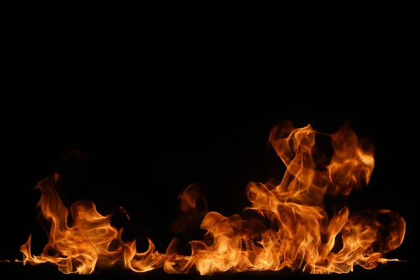 Fire flames on black background. - Photo, image