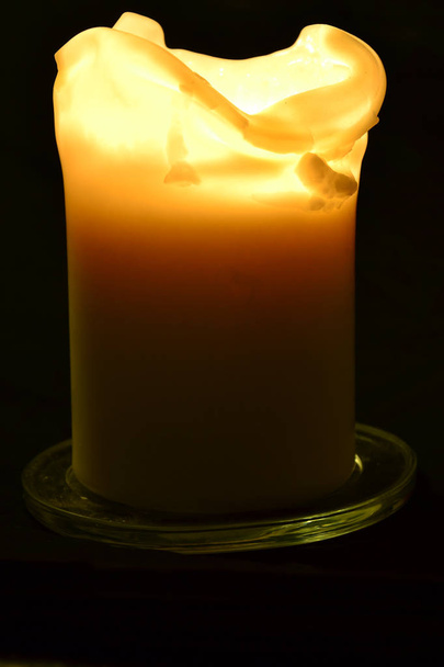 Burning candle on a black background - flame photography - Photo, Image