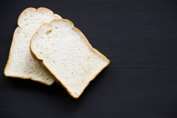 Bread on the wooden floor - Фото, изображение