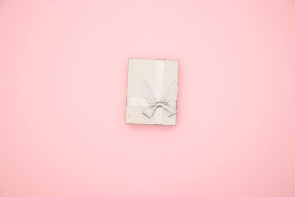 Silver present box on pink background  - Fotografie, Obrázek