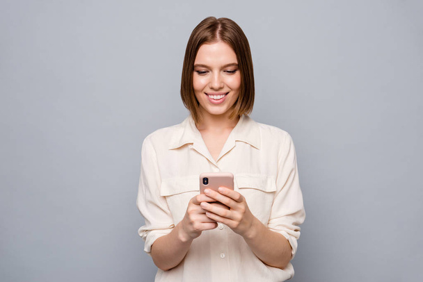 Close up photo amazing beautiful nice she her lady hold hands arms telephone wondered look screen reader email letters instagram followers using wear casual white shirt isolated grey background - Photo, Image